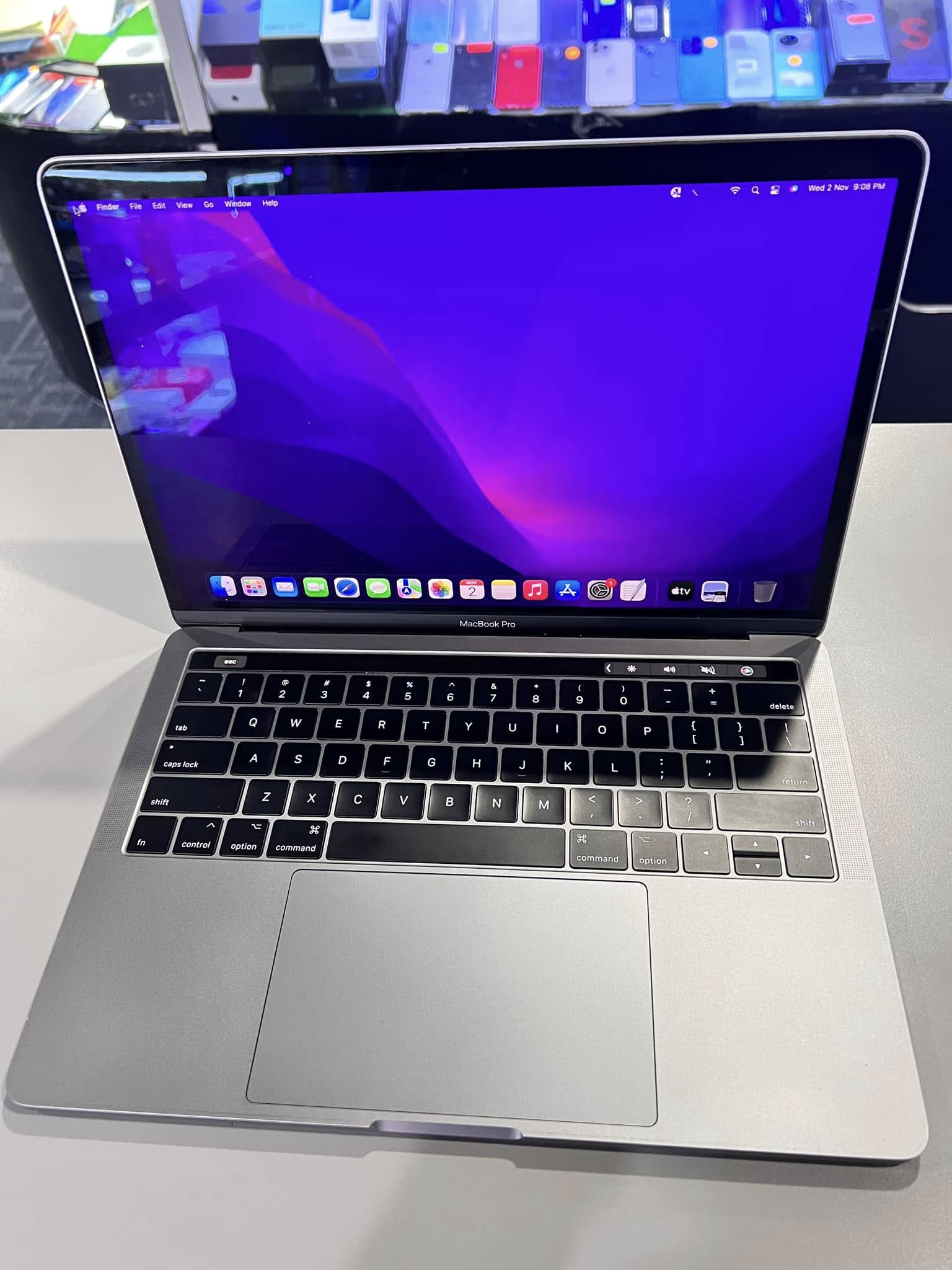 Open MacBook with a purple desktop from the A&Z social archive