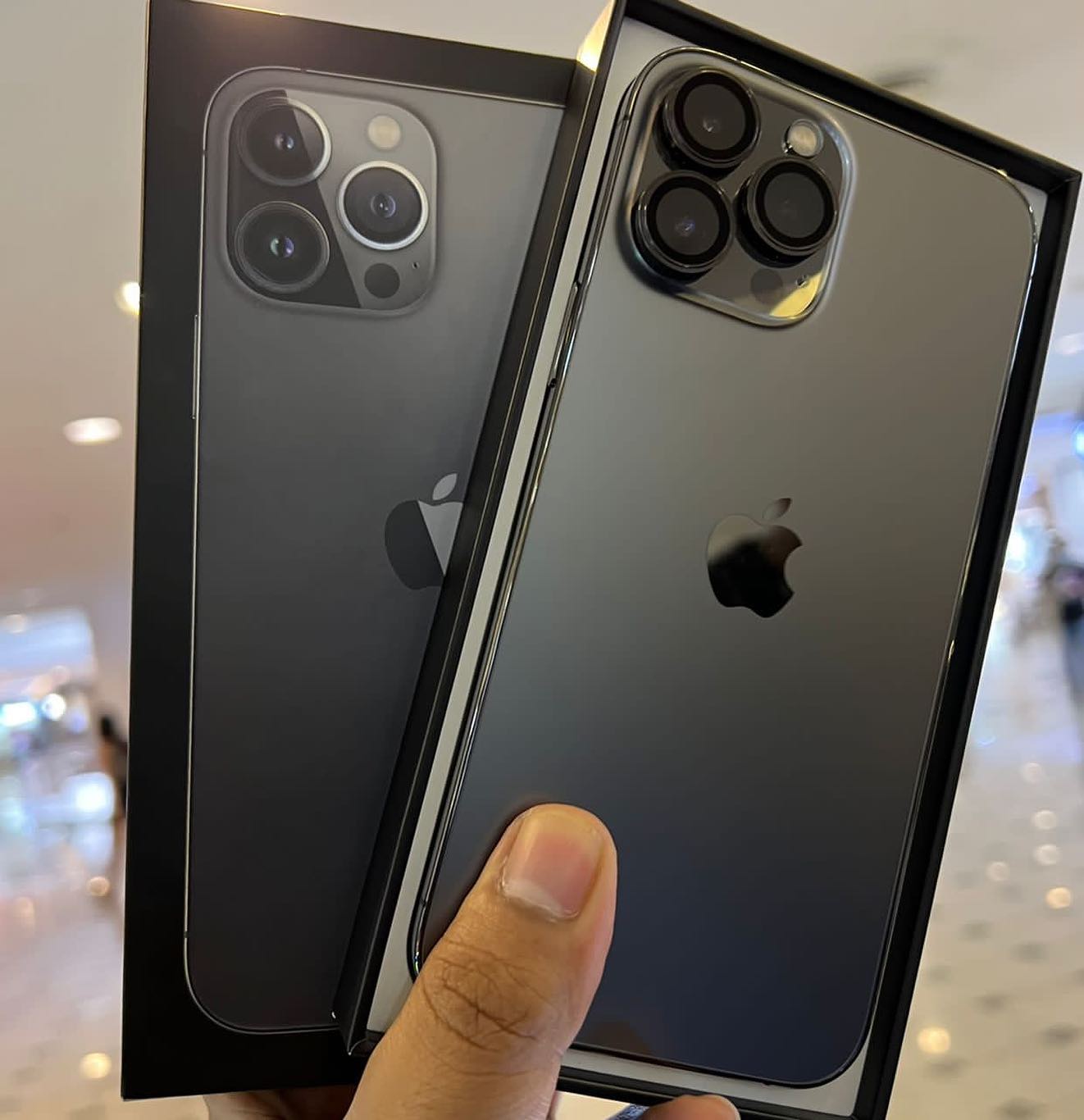 Graphite iPhone shown with its box in a photograph from the A&Z social archive